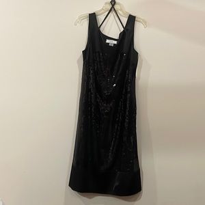 Black sequin dress, straps and no sequin above the bust, it is shiny fabric.